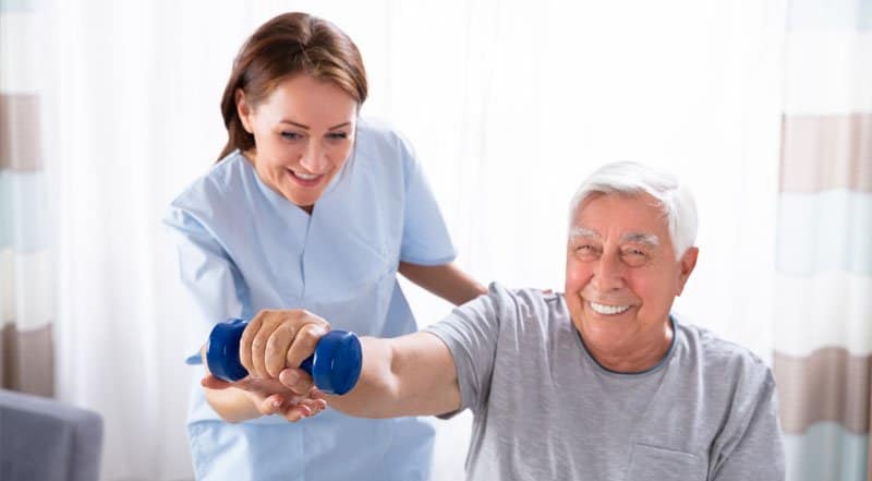 Family member smiling with senior loved one