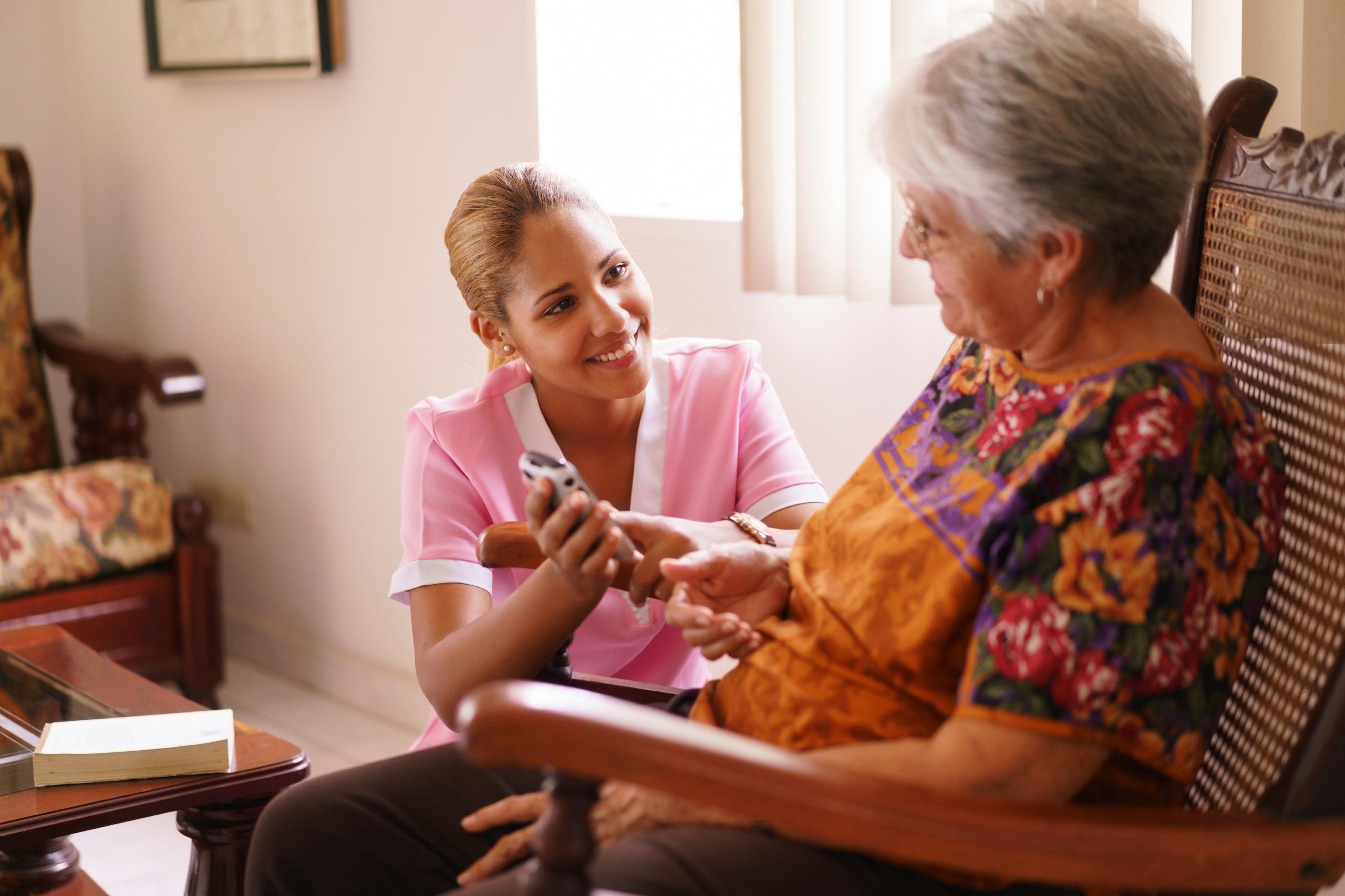 Compassionate caregiver supporting a senior at home in Beverly Hills